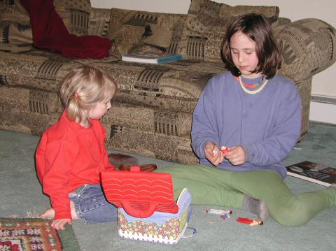 Sophie and Susannah play with the new dollhouse