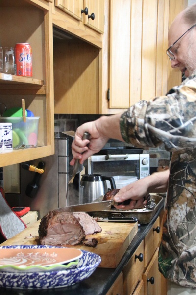 Matt carves the pork