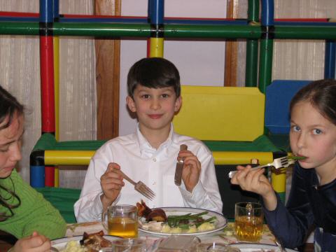 Adam presides at the kids' table